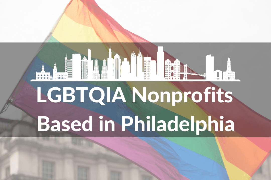 An image of a rainbow flag waving in the background. In the foreground, there is a white graphic of a Philadelphia cityscape. Below the graphic are the words LGBTQIA Nonprofits Based in Philadelphia