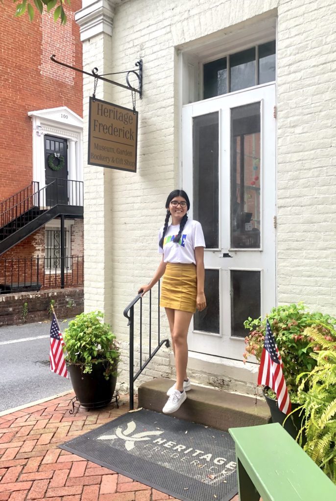 Maria Reyes Pacheco '24 outside of Heritage Frederick's headquarters. 